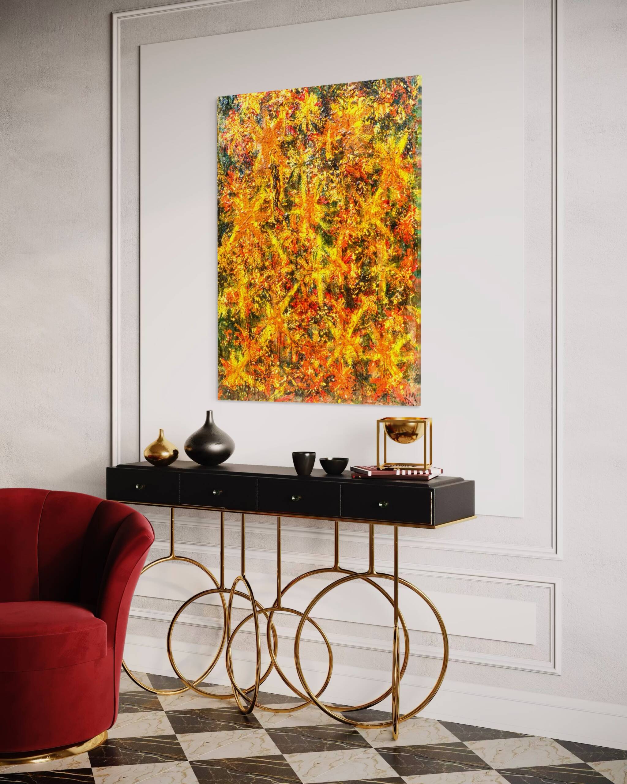 Abstract colorful painting on a light wall above a black console table with gold wire-frame chairs.