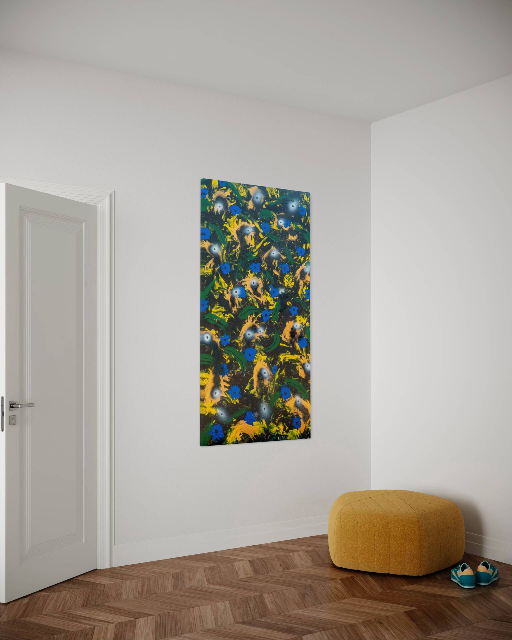 White-walled room corner with a tall colorful abstract painting, a light door to the left, and a mustard yellow pouf on a herringbone wood floor.
