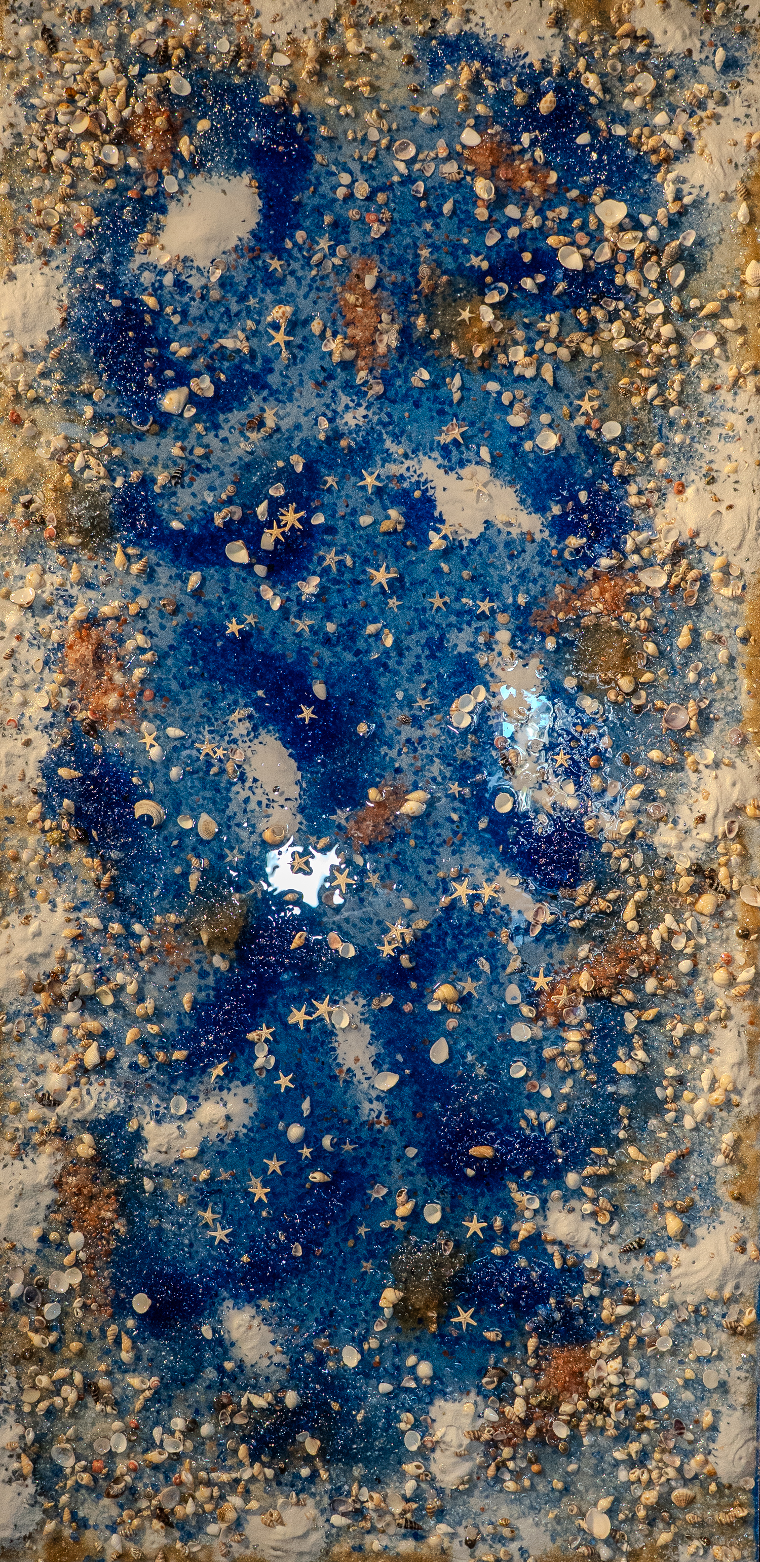 Ocean Breeze - A rectangular artwork features a textured mix of blue and white paint with scattered seashells.