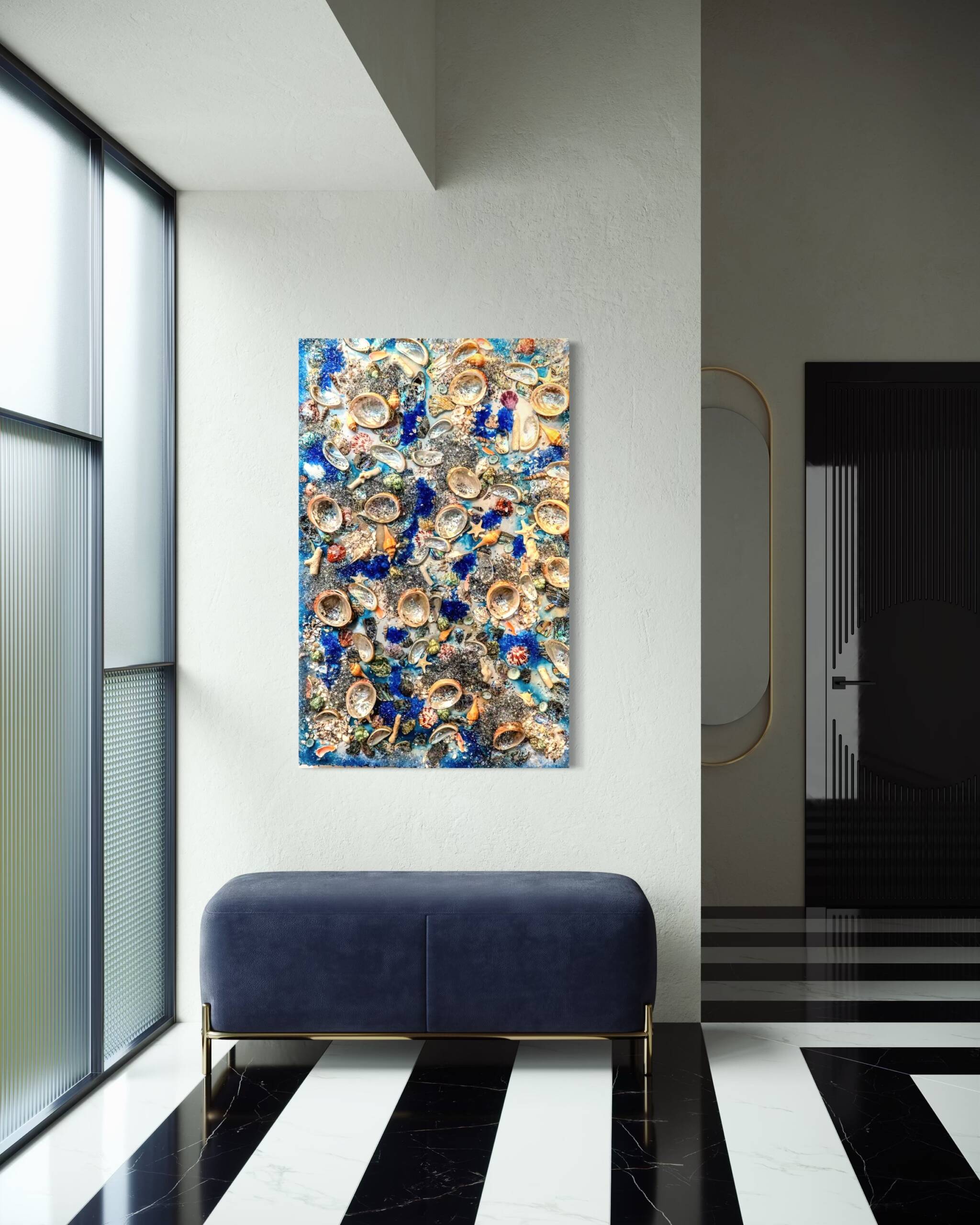 Modern interior with a dark blue velvet bench, black-and-white striped floor, and a colorful shell-centered painting on a light wall.